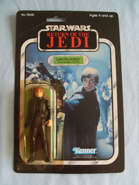 Jedi luke 65 back, green saber with snap cape visable in box. Tj_65-26