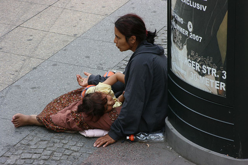 Romanian Gypsies selling dodgy notes., Begging