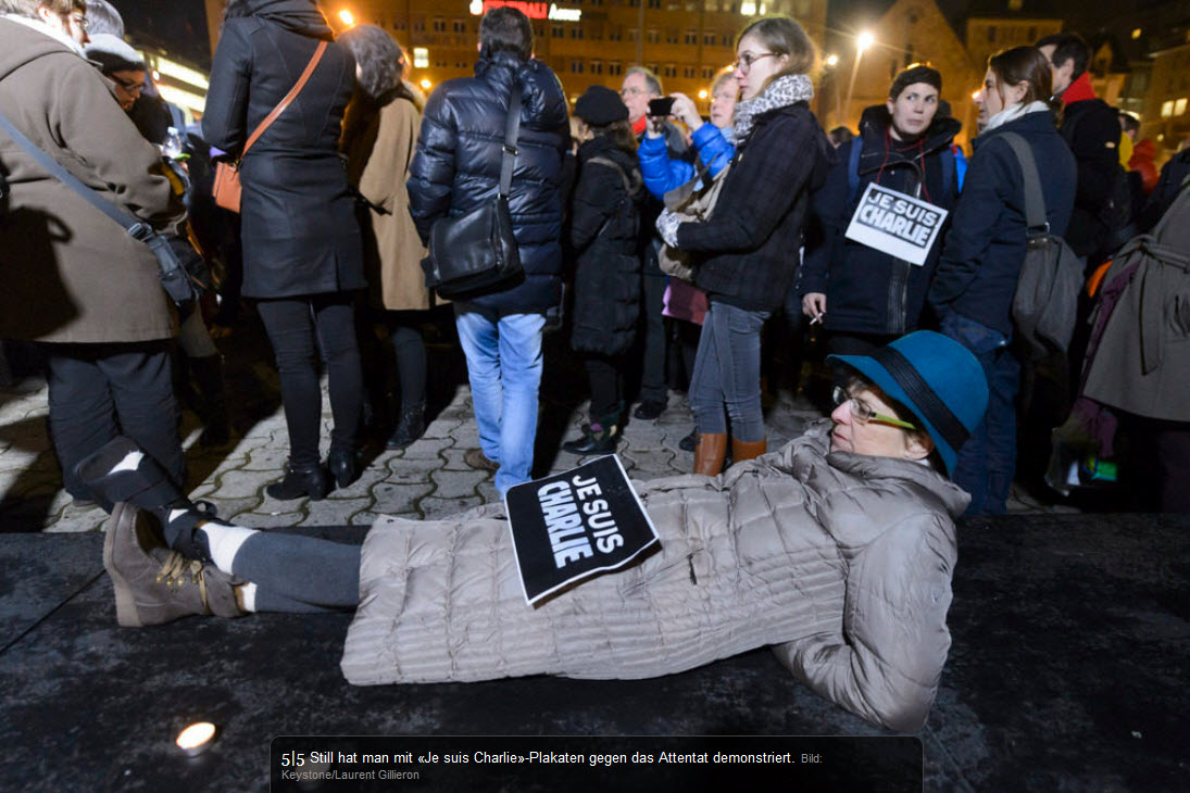 SULMI NDAJ CHARLIE HEBDO - GAZETARËT MBAJNË MANIFESTIM ZIE NË BERNË, GJENEVË, ZYRIH U2_solid4