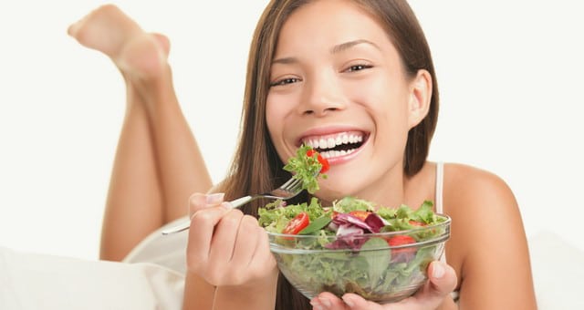 Experts Claim Passion for Eating Healthy Has Become a Mental Disorder Happy-woman-eating-salad