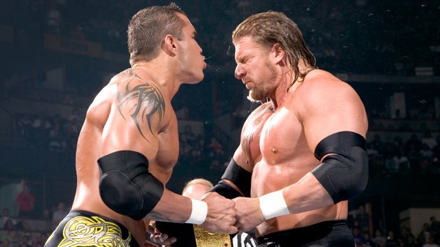 [Divers] Top 25 des feuds les plus personnelles selon WWE.com Orton_trips_art
