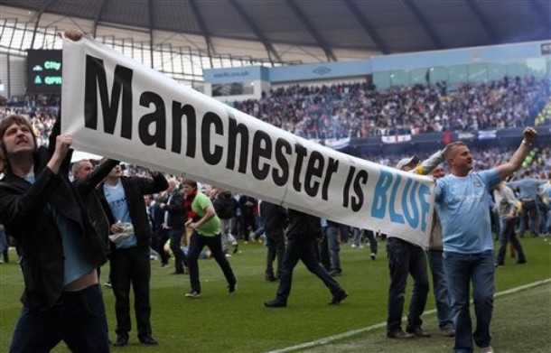 Season 11/12 - May - Page 3 883050ManchesterCityfanscelebratewinningtheEnglishPremierLeaguetitleaftertheirsoccermatchagainstQueensParkRangers2012