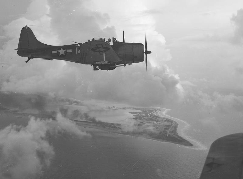 DOUGLAS DAUNTLESS 231726A_Douglas_SBD_Dive_Bomber_over_Wake_Island__1943