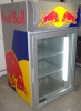 This is a medium size countertop fridge. Details to idenify are the fluorescent lights down each side inside the cooler and the guts of the fridge in a compartment on the top rear of the fridge. Full specs here:

http://www.energydrinkfridge.com/t22-official-red-bull-fridge-model-vv-3-information-and-facts