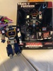 A planned redeco of Titanium Soundwave in his black and red Soundblaster colors, this toy would have come with a new Titanium version of Ravage instead of Laserbeak.