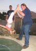 Justin swinging Ariana over the hot tub... she was so scared... No kids were harmed in the making of this photo =)