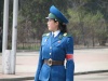 Ever alert, the Pyongyang Traffic Girl in her trim blue uniform is a most captivating figure of authority.