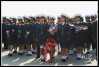 The Pyongyang traffic police, laying flowers at the base of the big huge giant bronze statue of Kim Il-Sung, beloved Great Leader of the DPRK