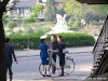 The Pyongyang traffic patrolwoman may be offering bicycle safety advice to these DPRK citizens.