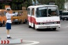 From the safety of her podium, the Pyongyang Traffic Warden gives a left turn permission to a very modern-looking and no doubt mechanically sound bus.

from fresh888 flickr page