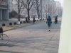 It looks like the Pyongyang Traffic Girl is here starting out the day, walking to her post.