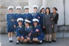 Some Pyongyang Traffic Women pose for a group picture.

pic from intermoumoute.com
(apologies to the guy edited out, but....)