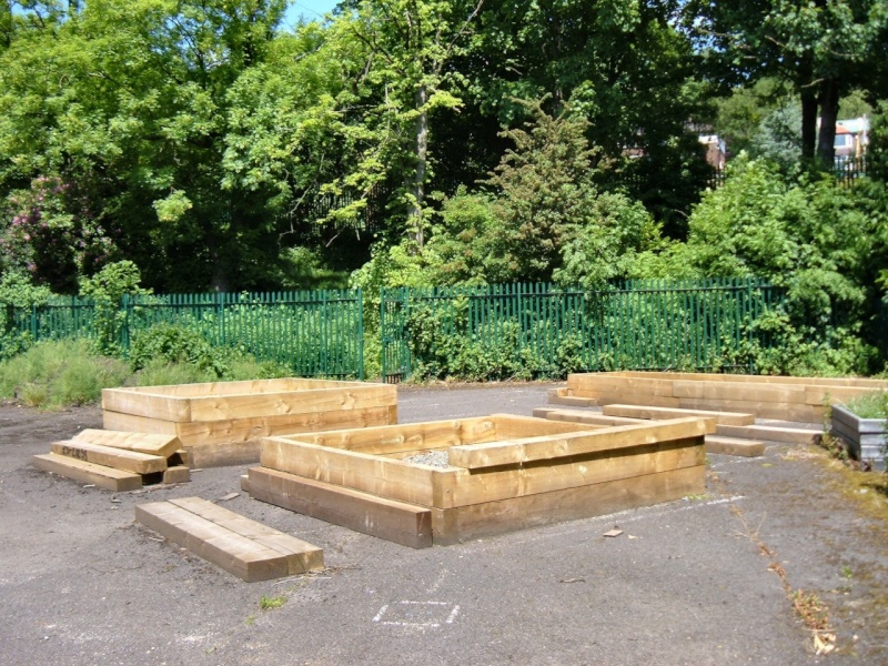 Every available space is used. Raised beds on tarmac