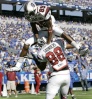 Joe Hills (85) leaps over the head of teammate Weslye Saunders (88)